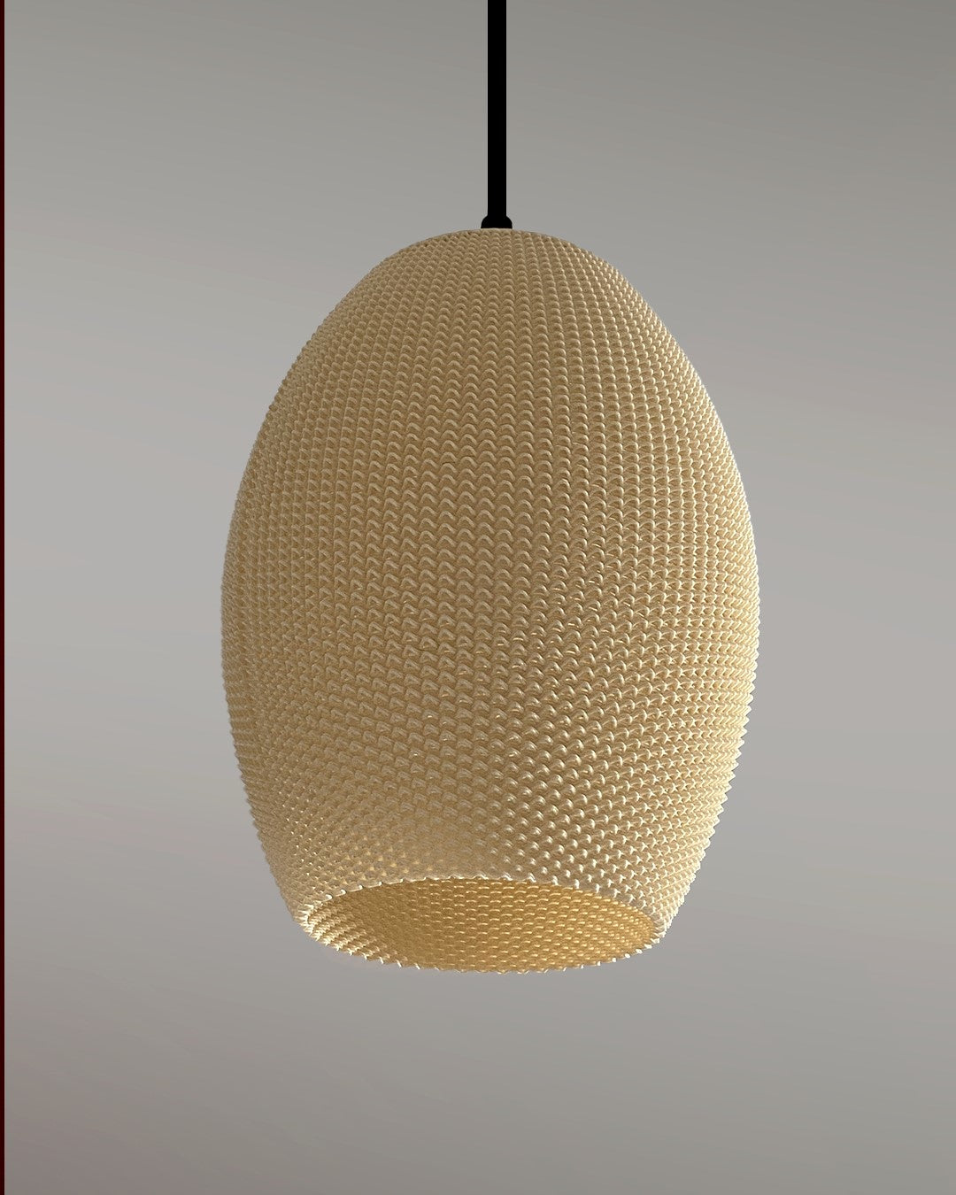 a white ball hanging from a black cord