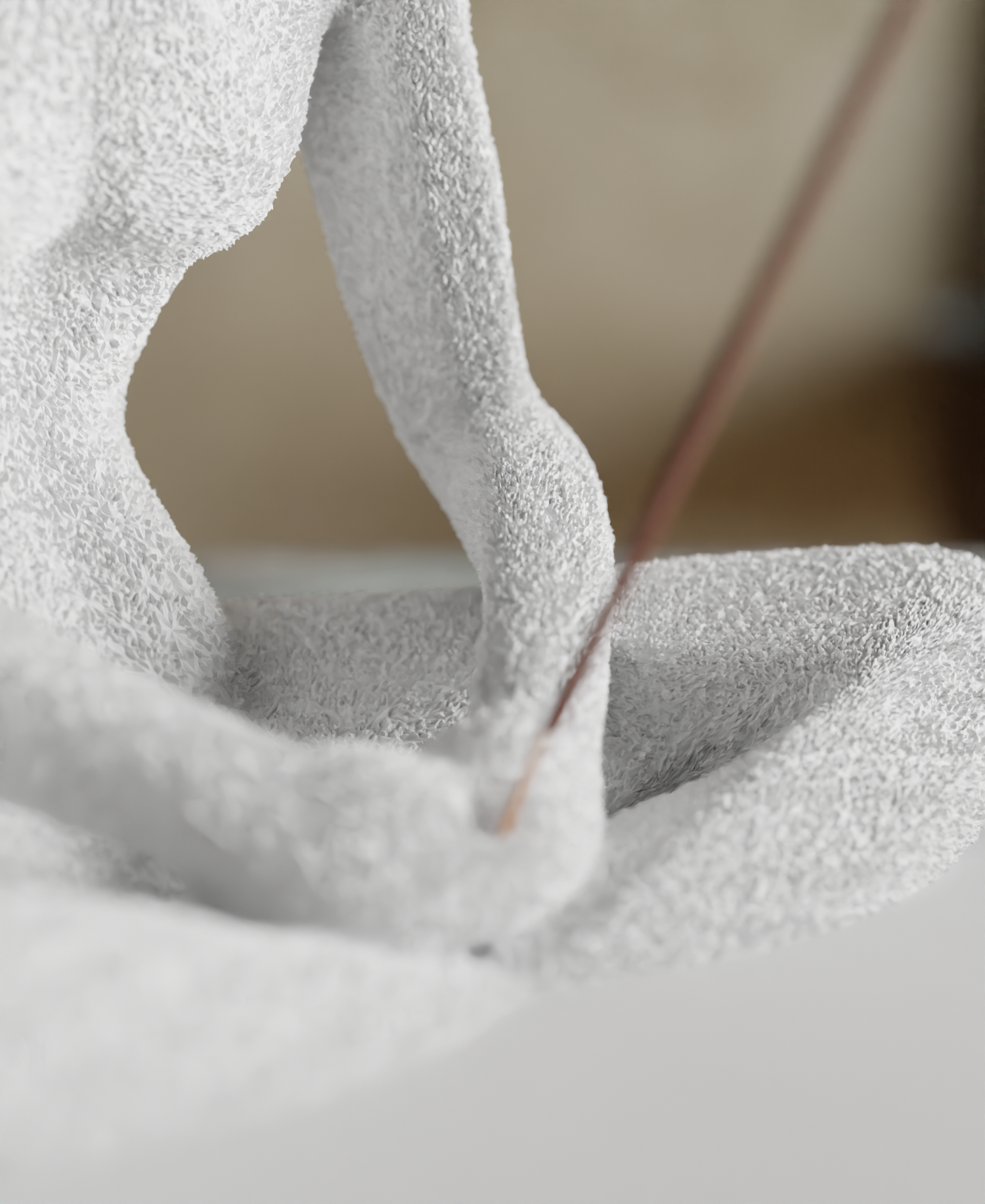 a towel sculpture is shown with a wooden stick sticking out of it