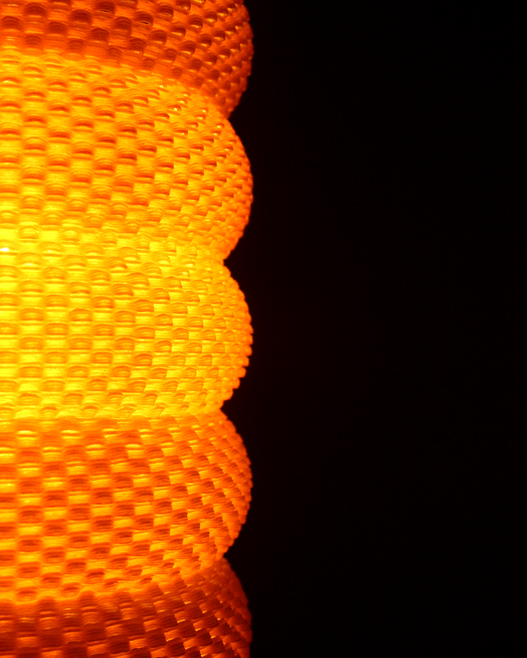 a close up of a traffic light with a black background