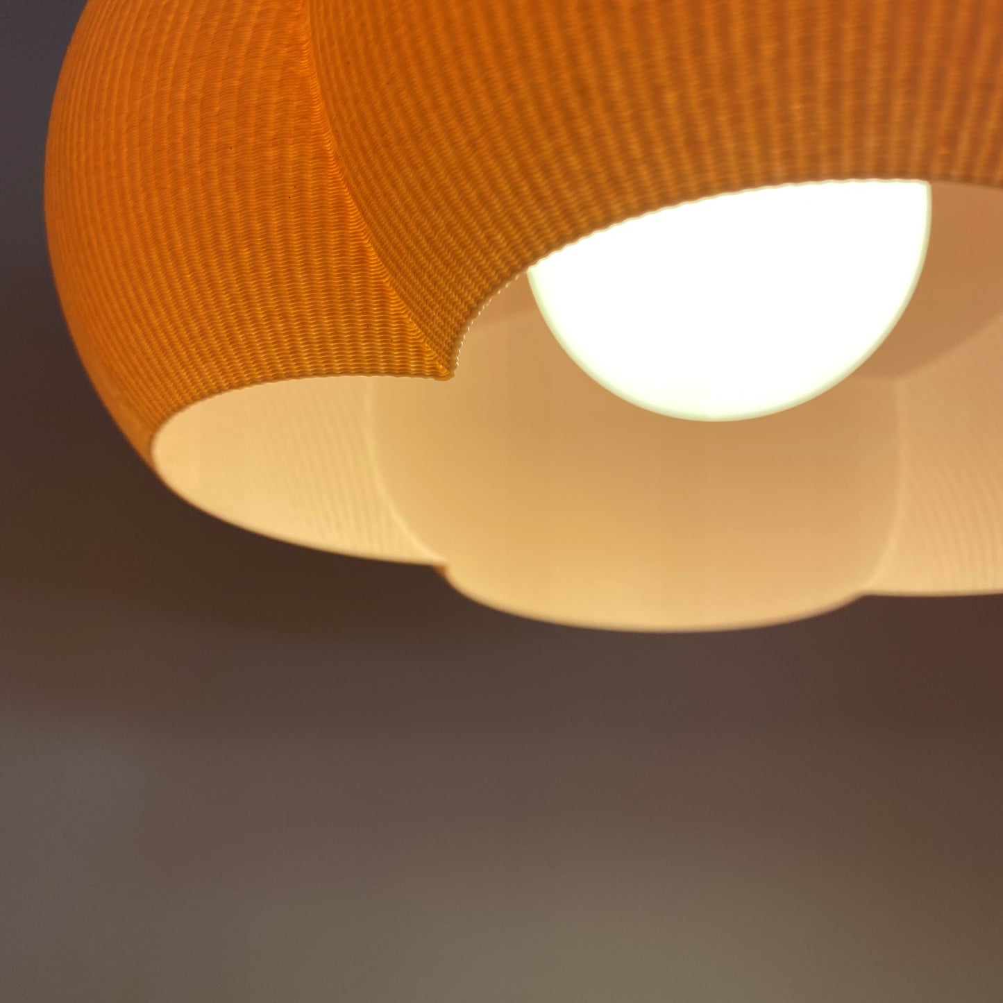 a close up of a light fixture with a blurry background