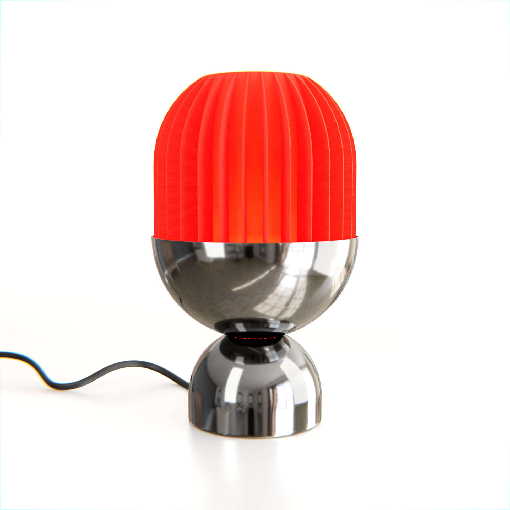 a red and silver lamp on a white surface