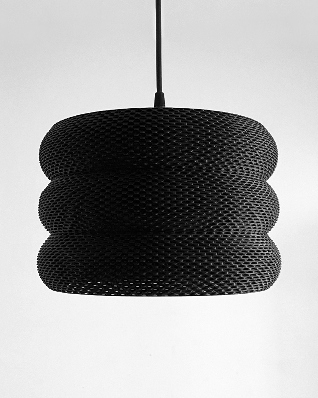 a black and white photo of a light fixture