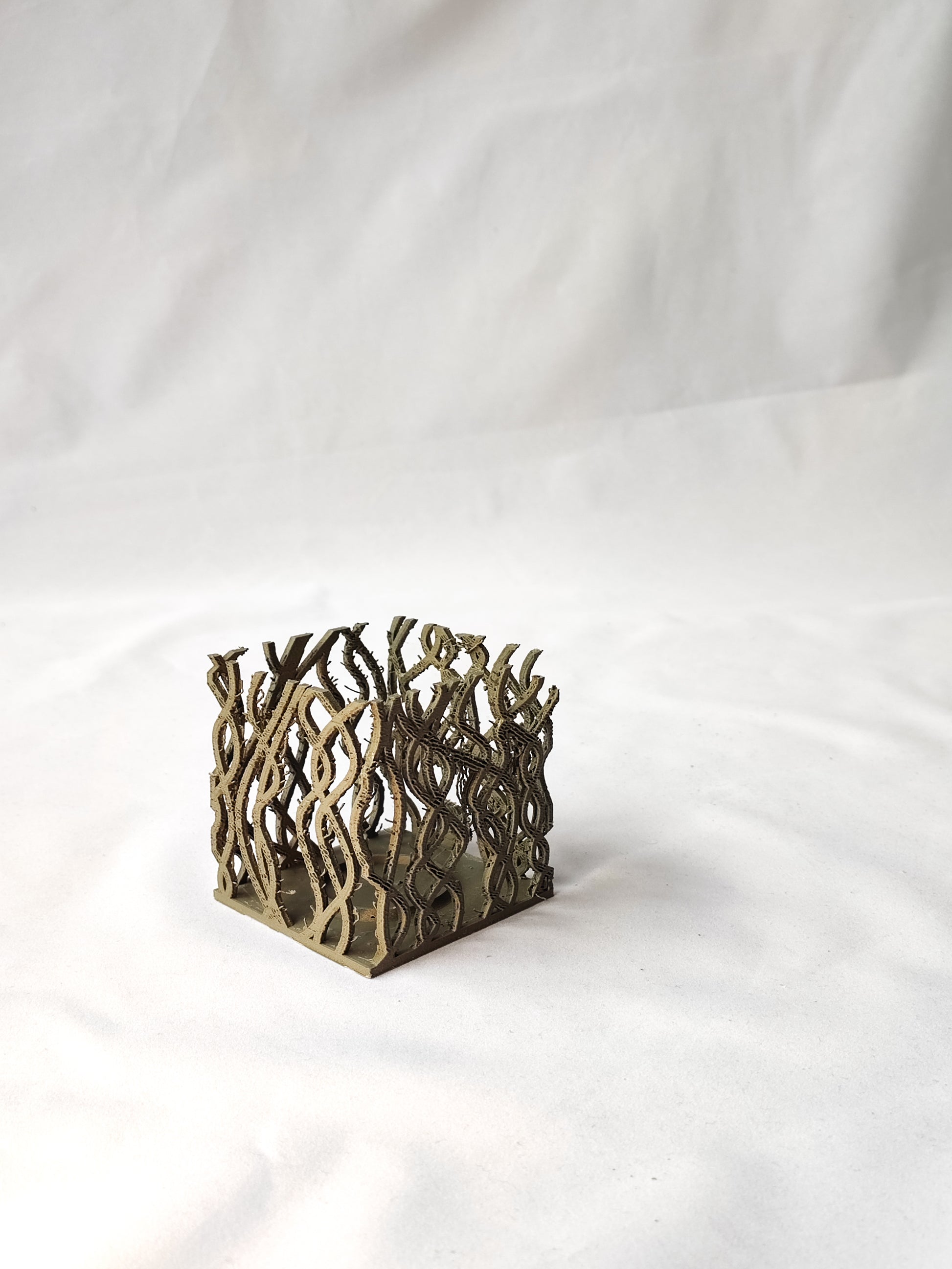 a close up of a metal object on a white background