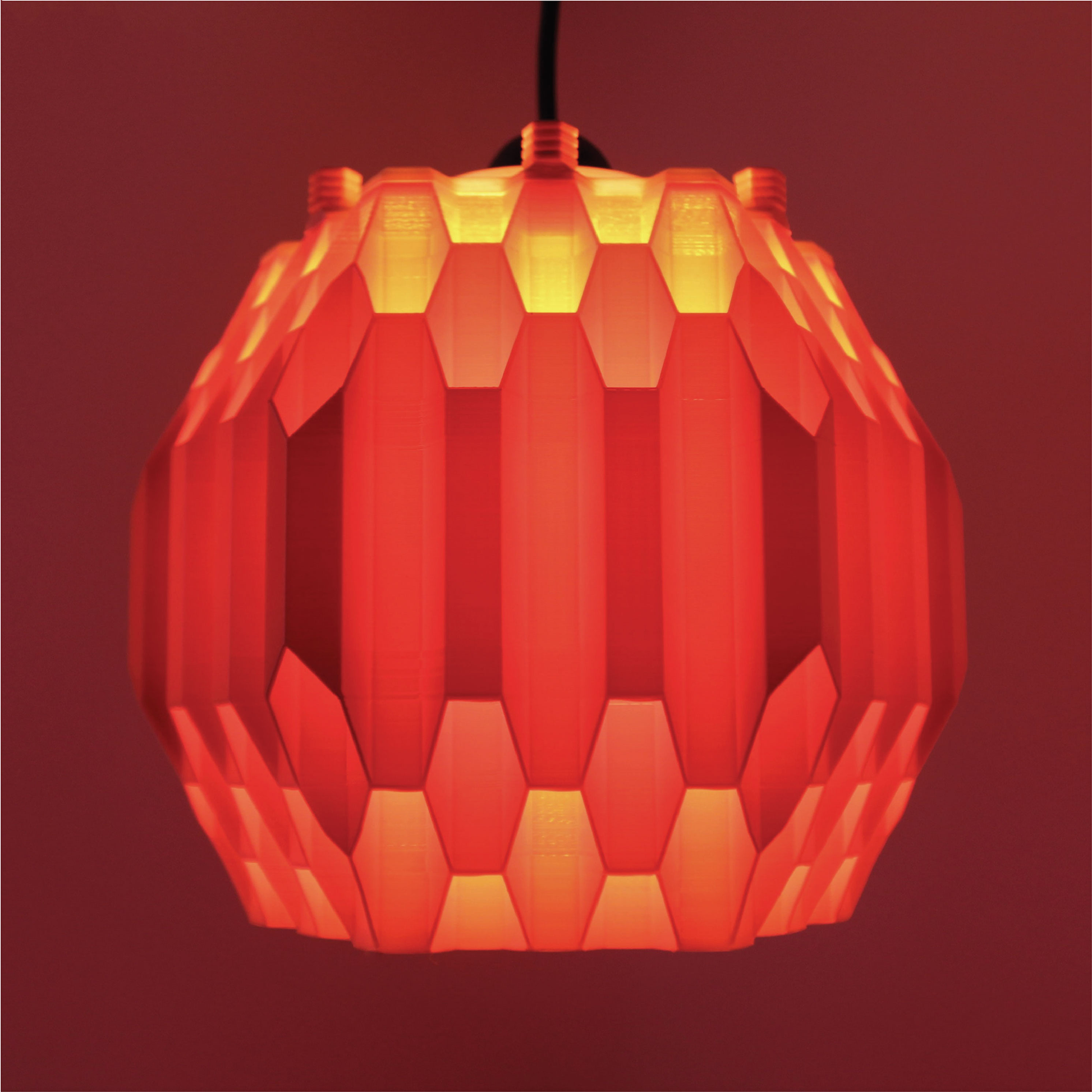 a red light hanging from a ceiling in a room