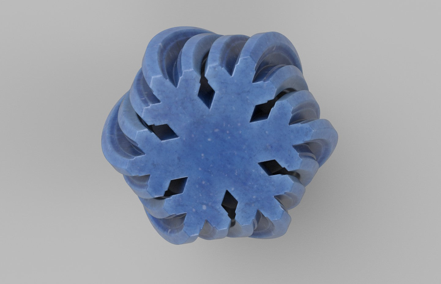 a close up of a snowflake on a gray background