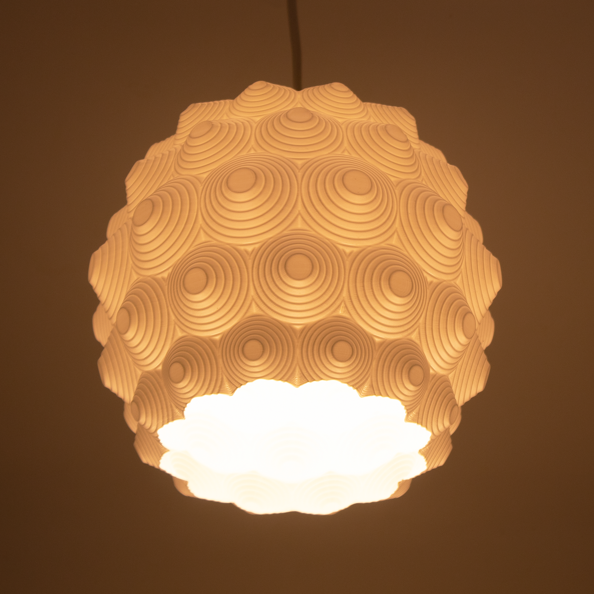 a light hanging from a ceiling in a room