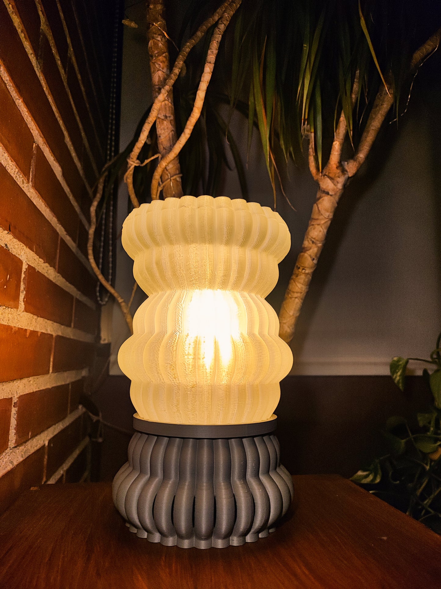 a lamp sitting on top of a wooden table