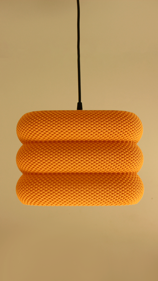 a yellow light hanging from a ceiling