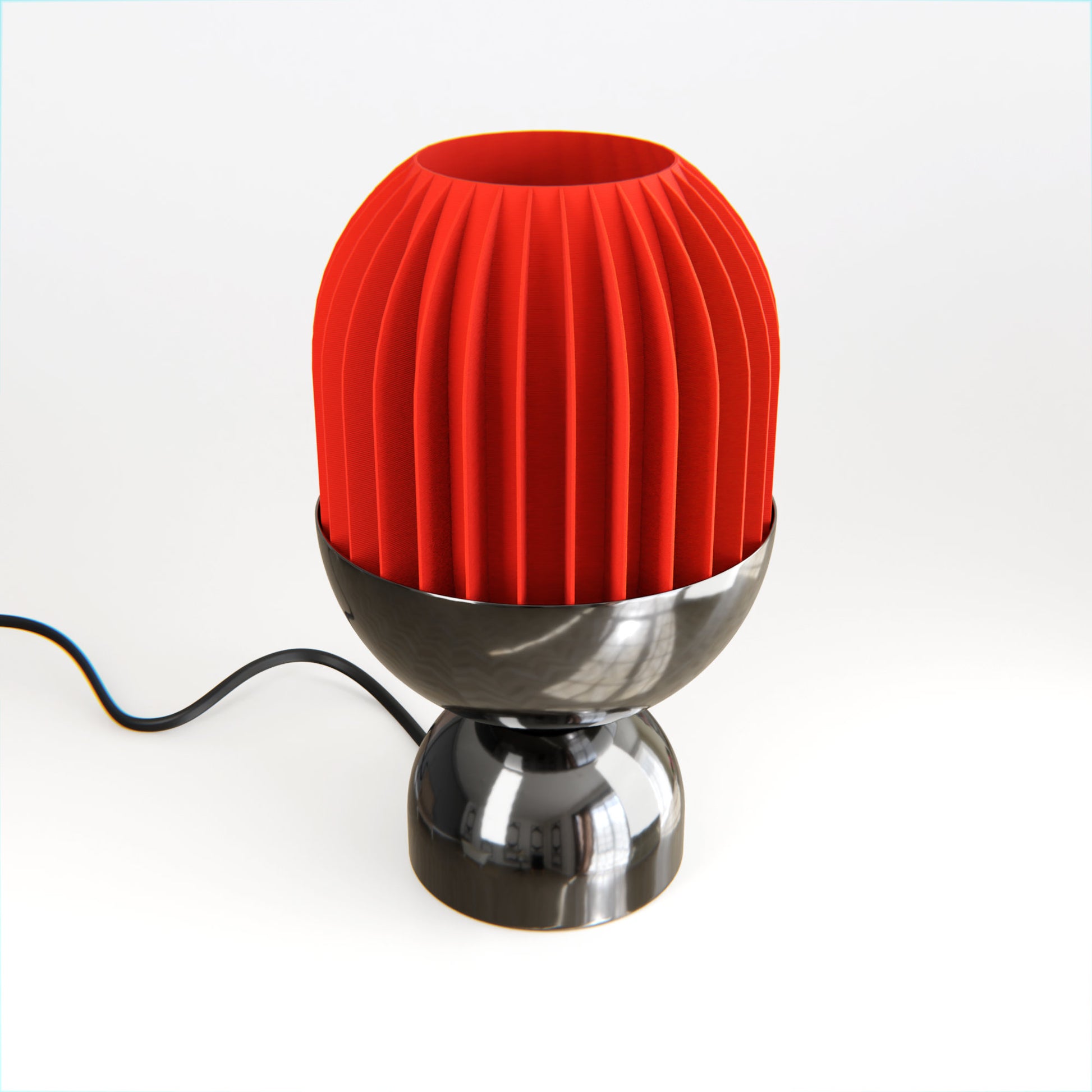 a red pleated lampshade sitting on top of a metal base