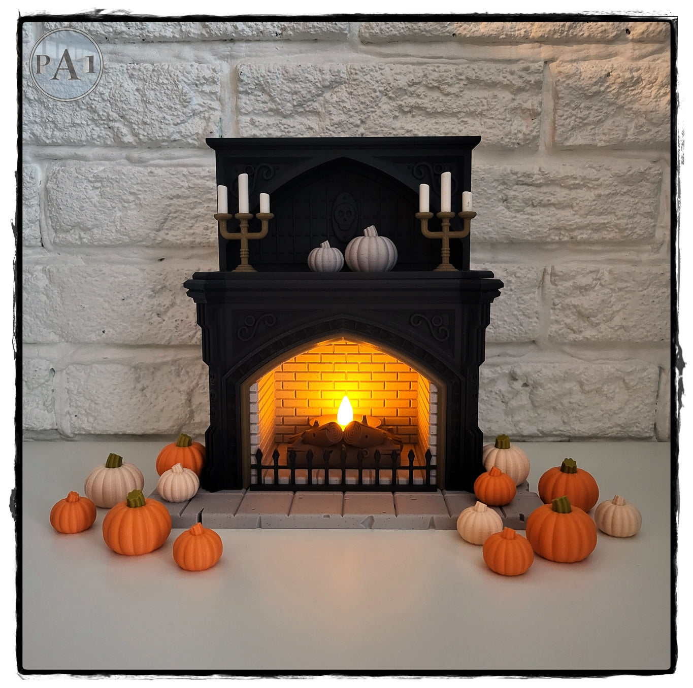 a miniature fireplace with a lit fire, surrounded by a collection of small orange pumpkins and white pumpkins, creating a cozy and festive atmosphere.