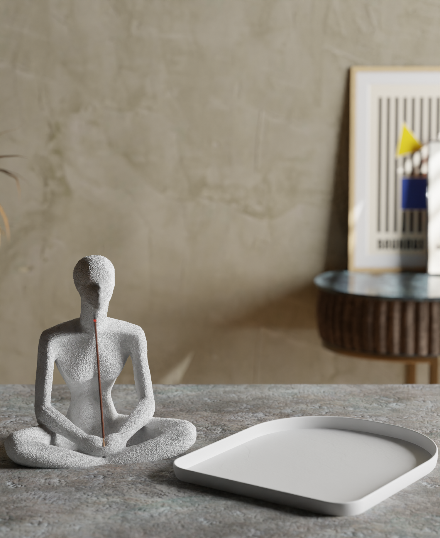 a white statue sitting on top of a table next to a plate