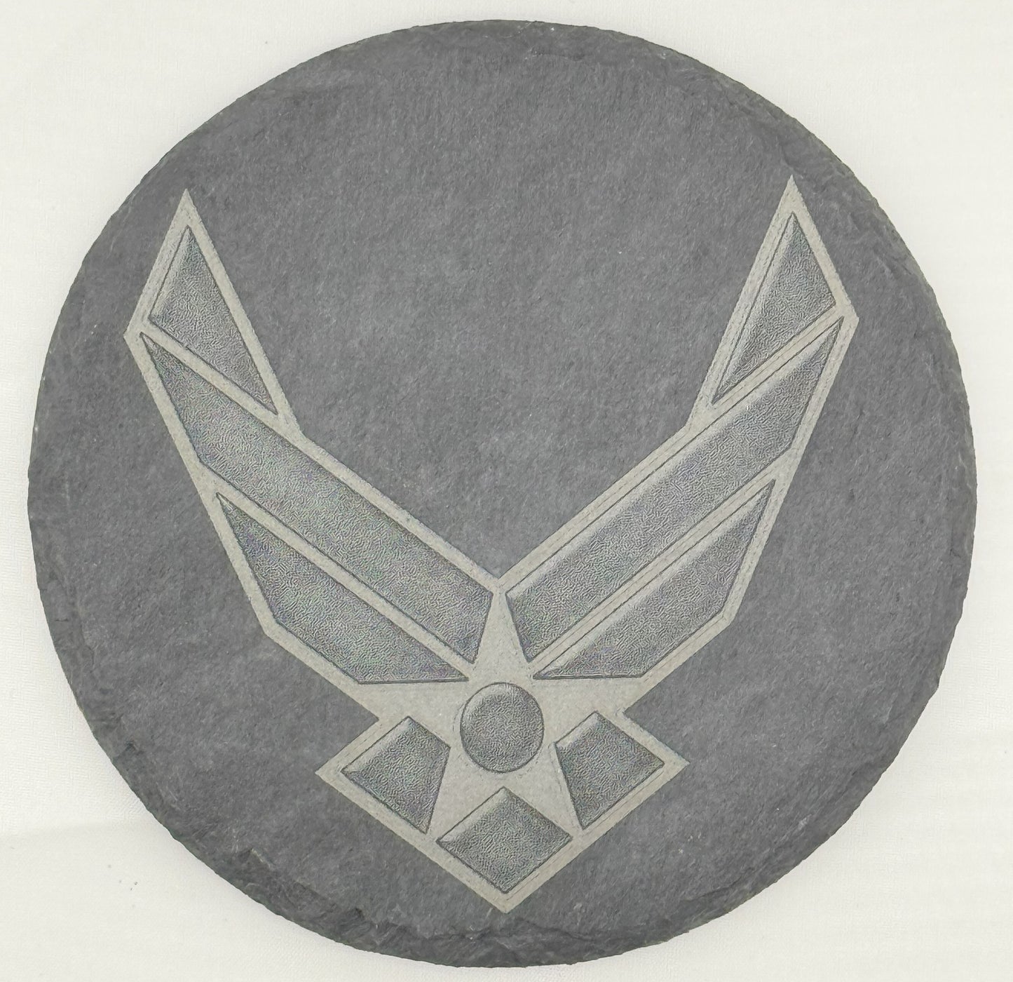 a stone with a picture of an air force emblem on it