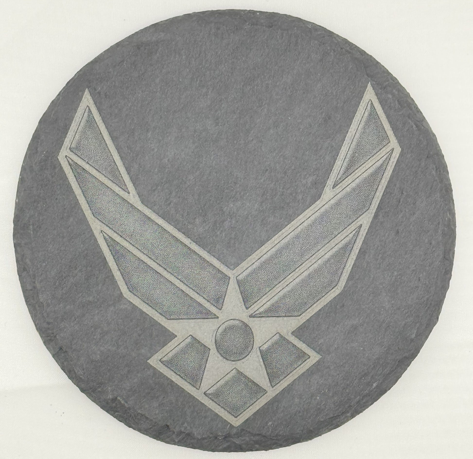 a stone with a picture of an air force emblem on it
