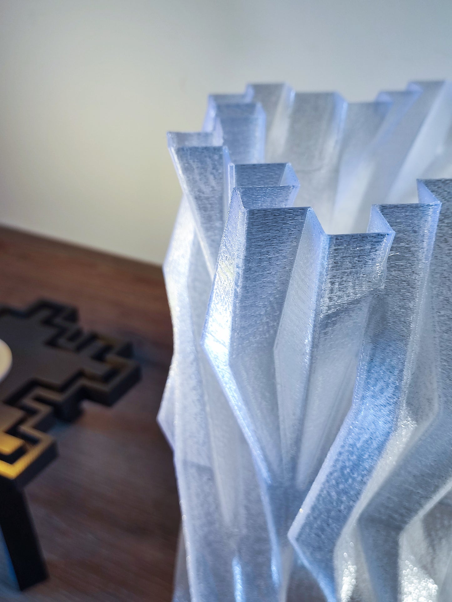 a close up of a vase on a table