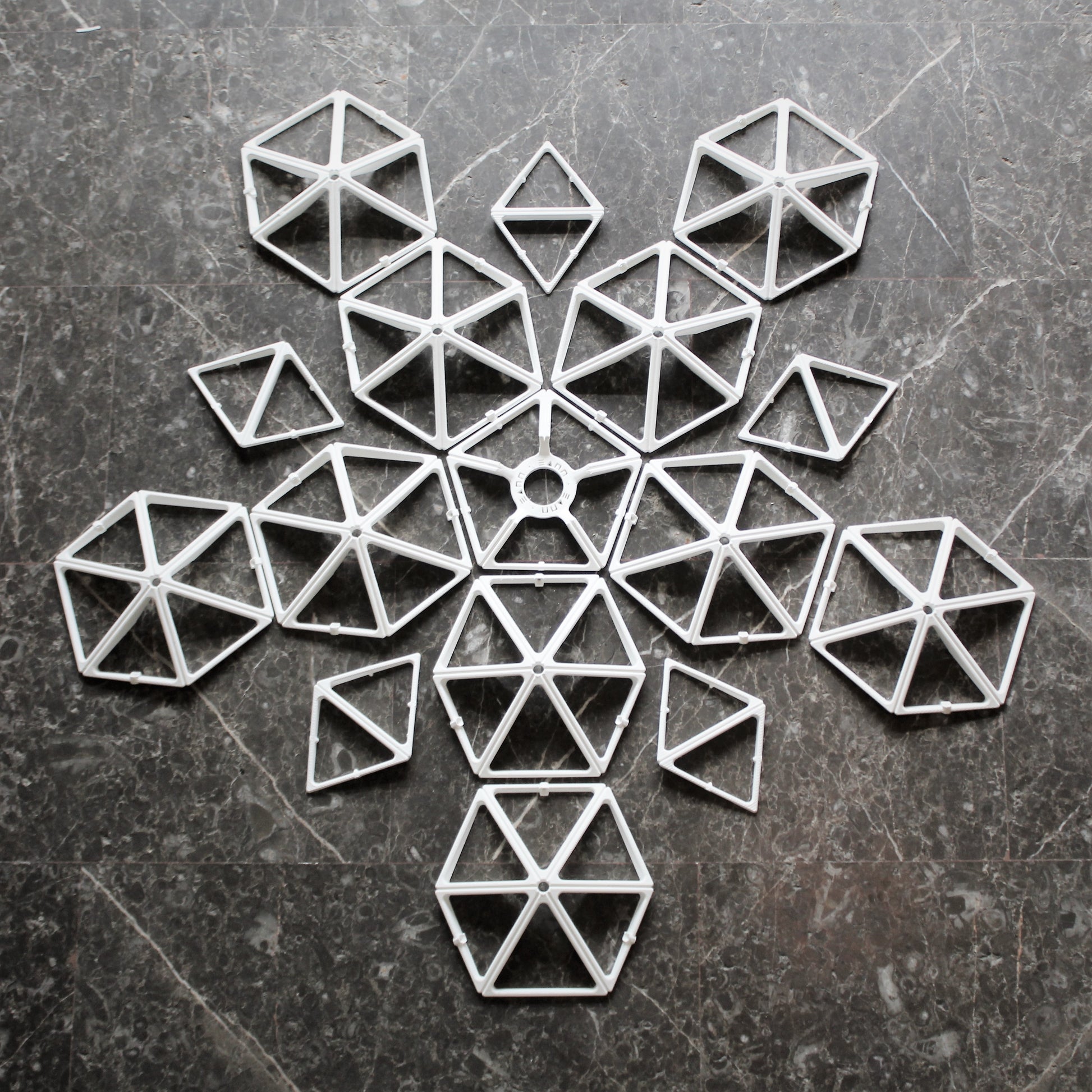 a cross made out of small pieces of paper