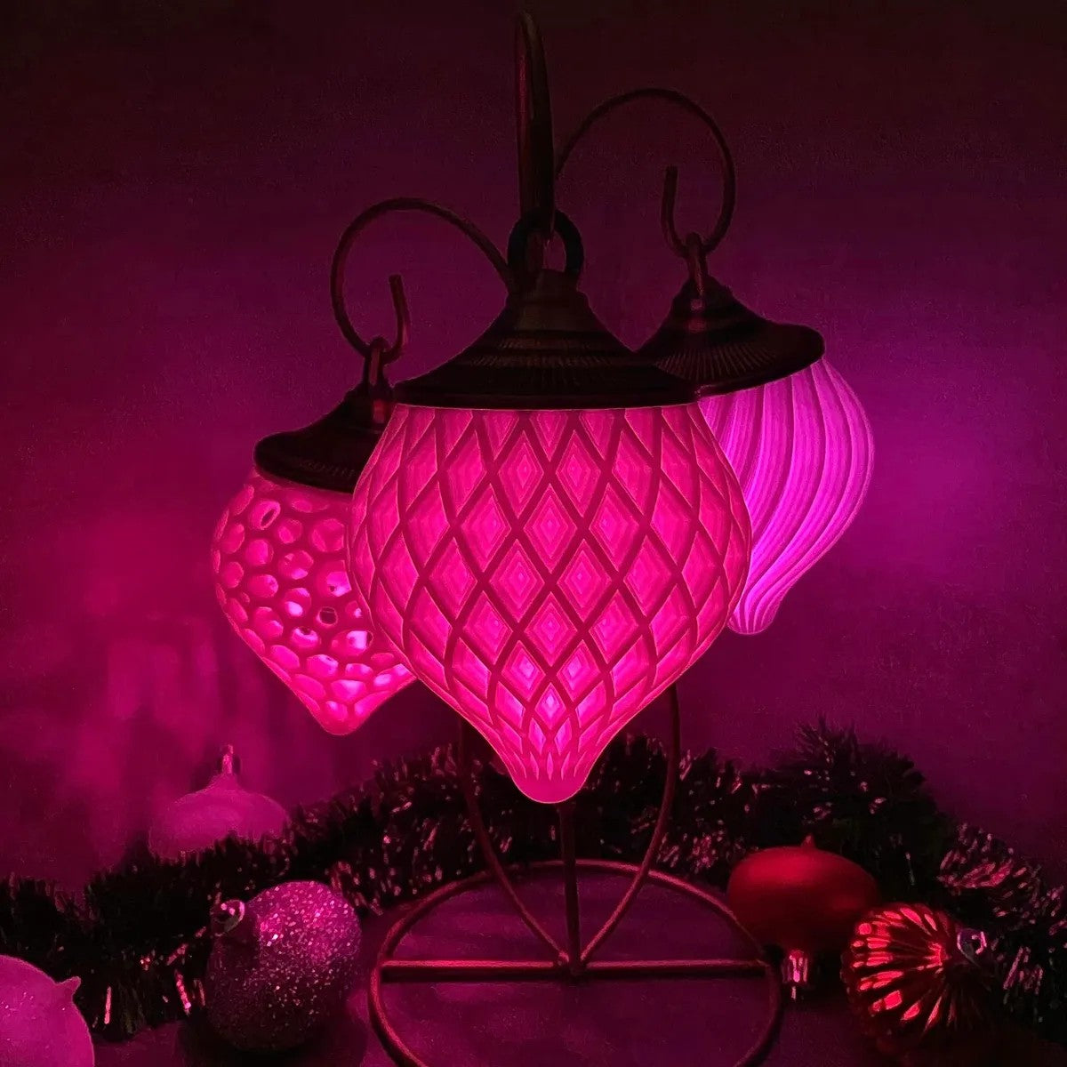 a purple light with ornaments around it on a table