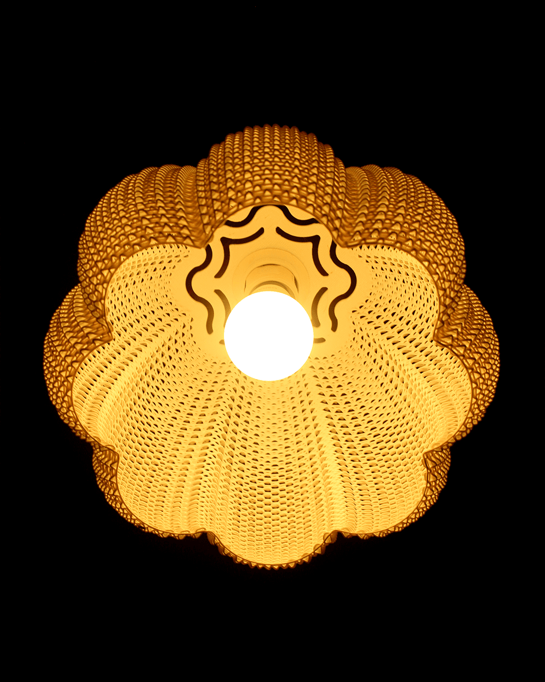 a close up of a light fixture with a black background