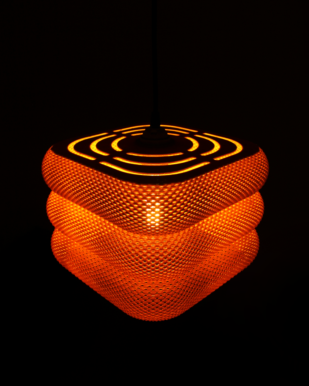 a close up of a lit object in the dark