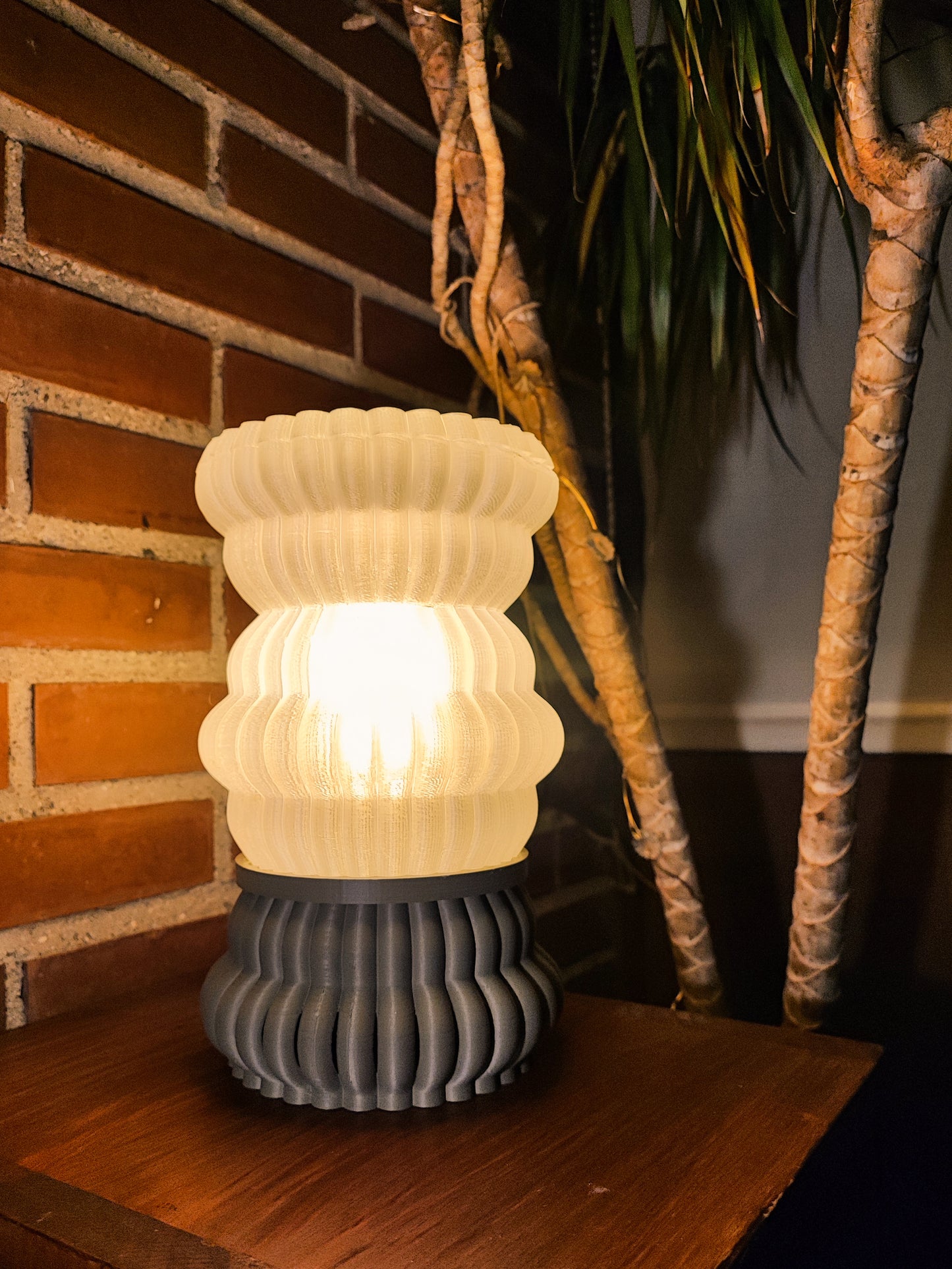 a lamp sitting on top of a wooden table