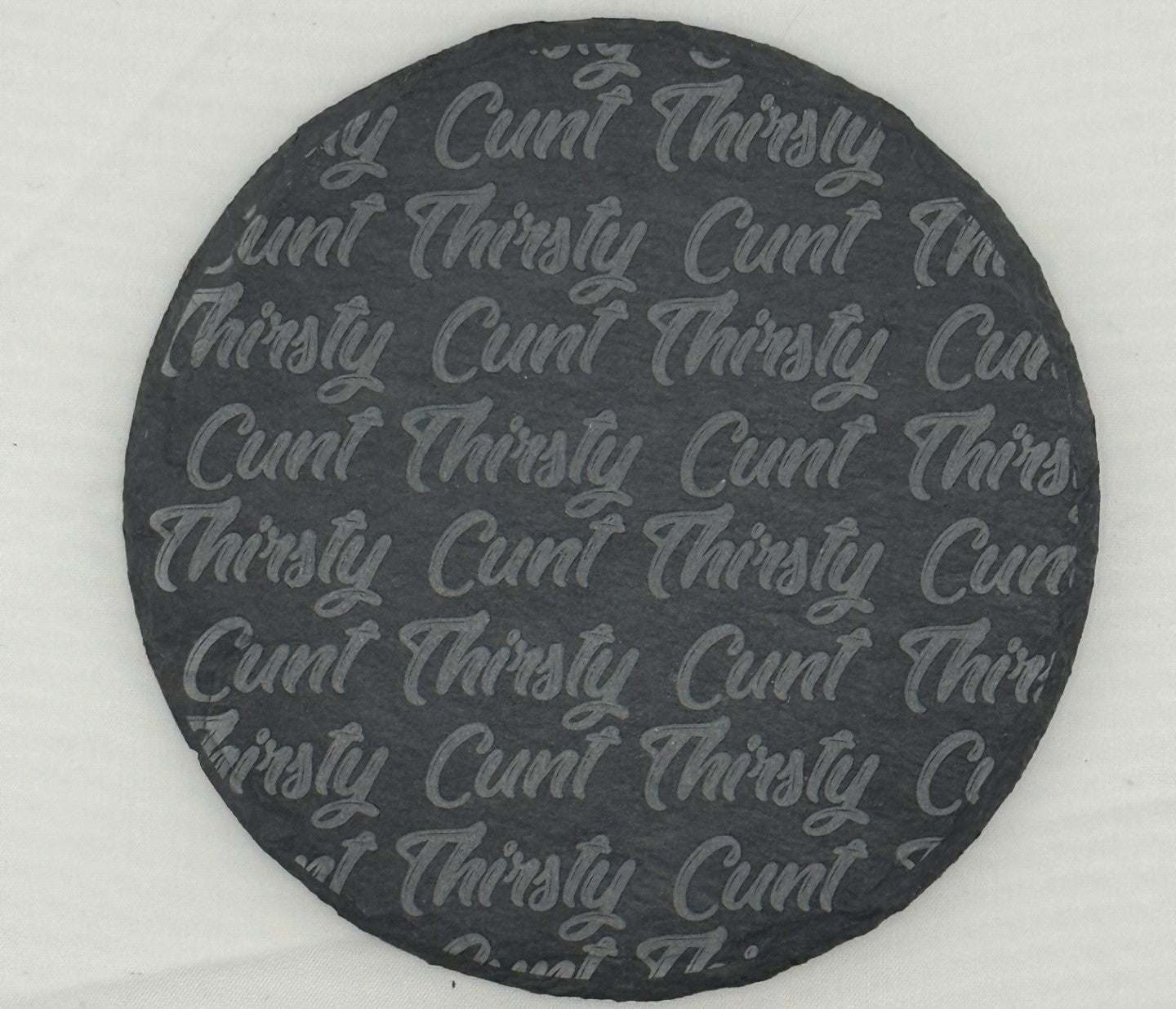 a black and white photo of a round plaque