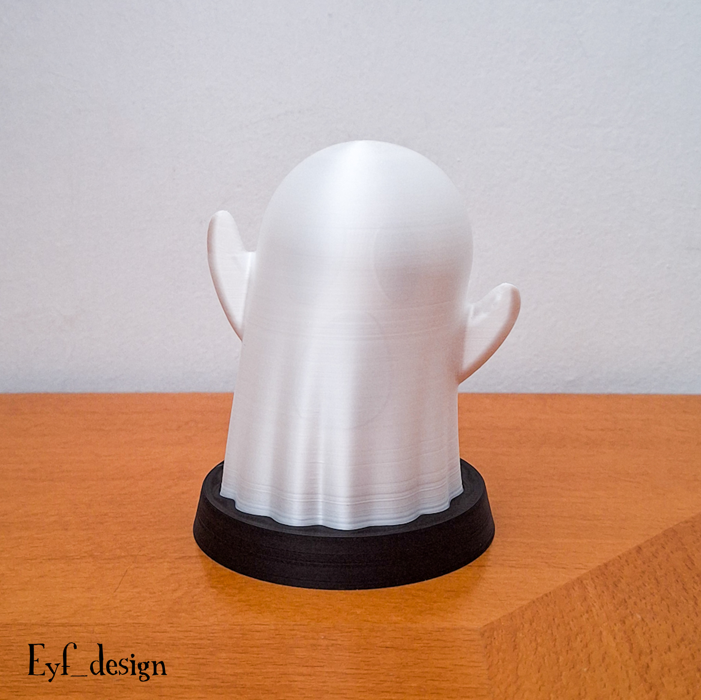 a white plastic head on a wooden table