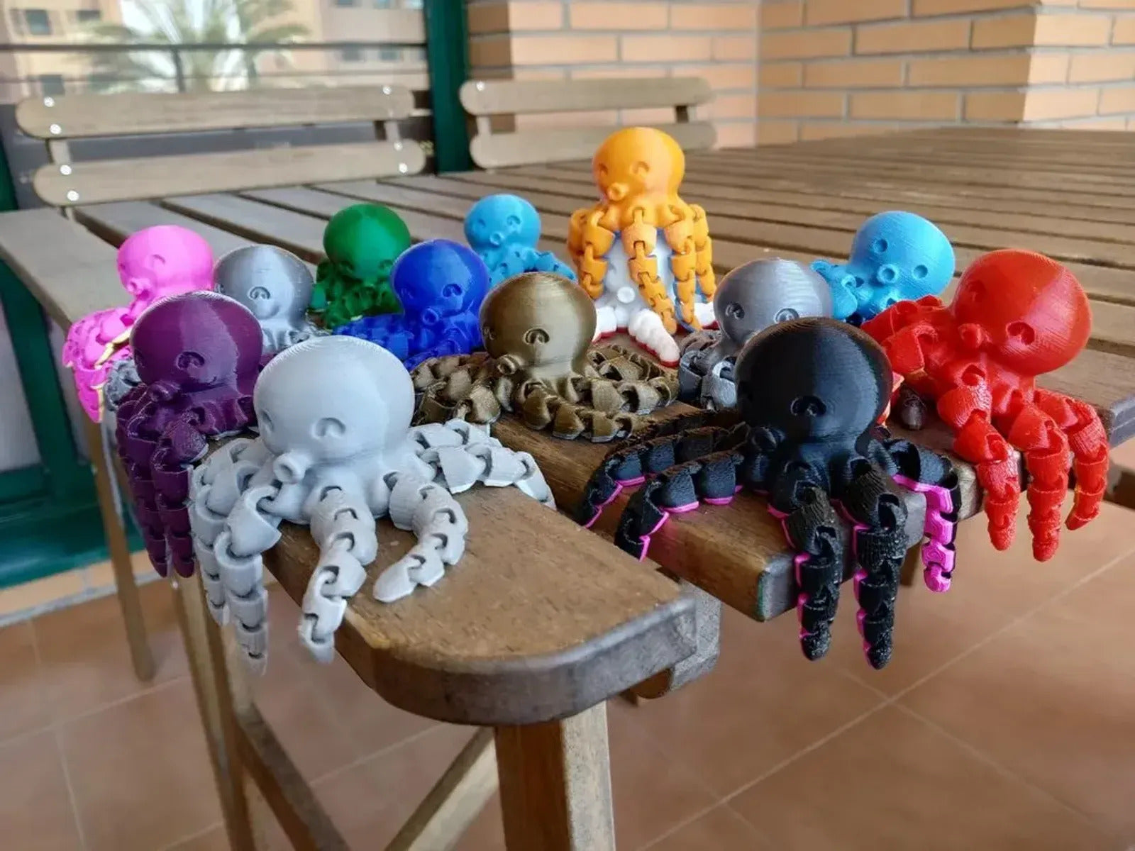 a group of octopus toys sitting on top of a wooden table