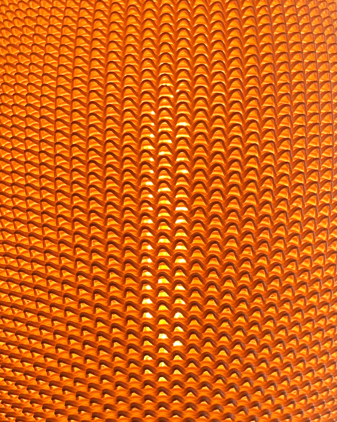a close up of an orange background with wavy lines