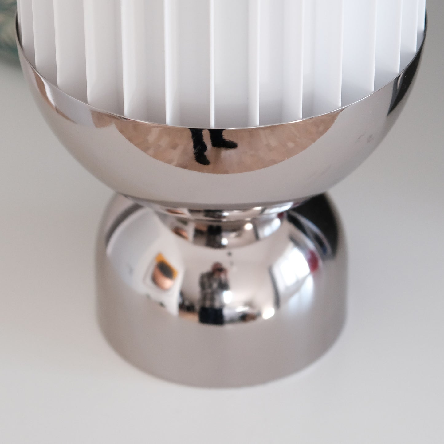 a close up of a silver object on a table