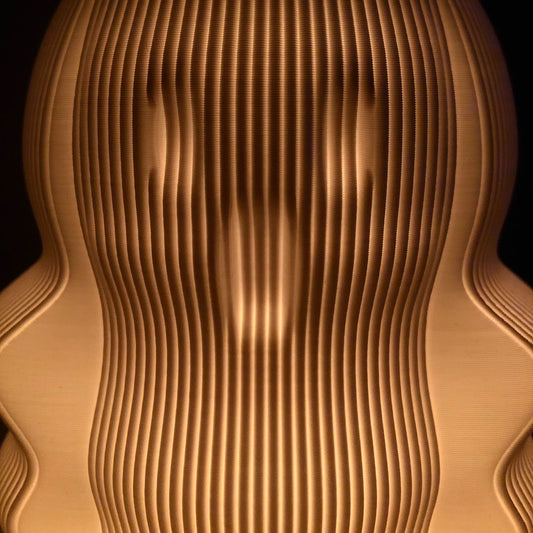 a close up of a wooden object with a black background