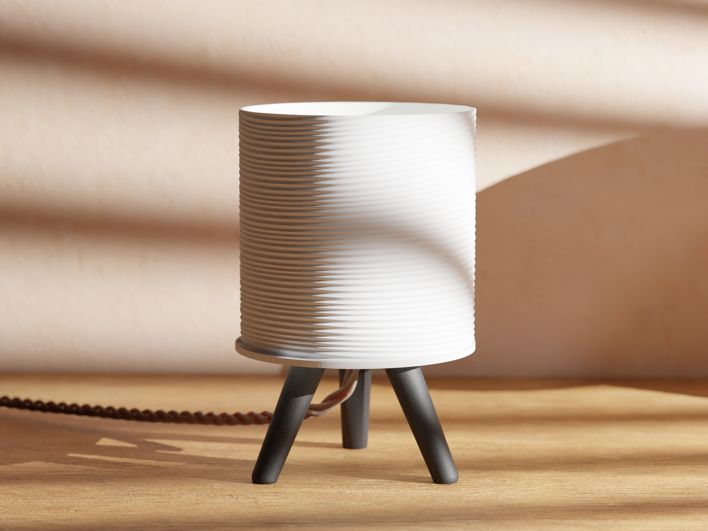 a white lamp sitting on top of a wooden table