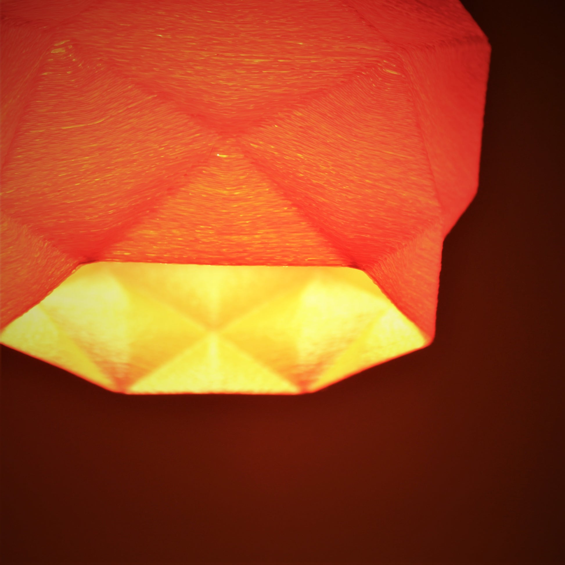 a red light hanging from a ceiling in a room