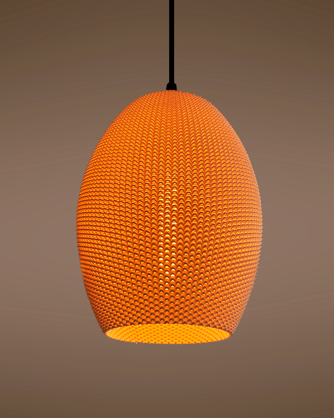 a large orange light hanging from a ceiling