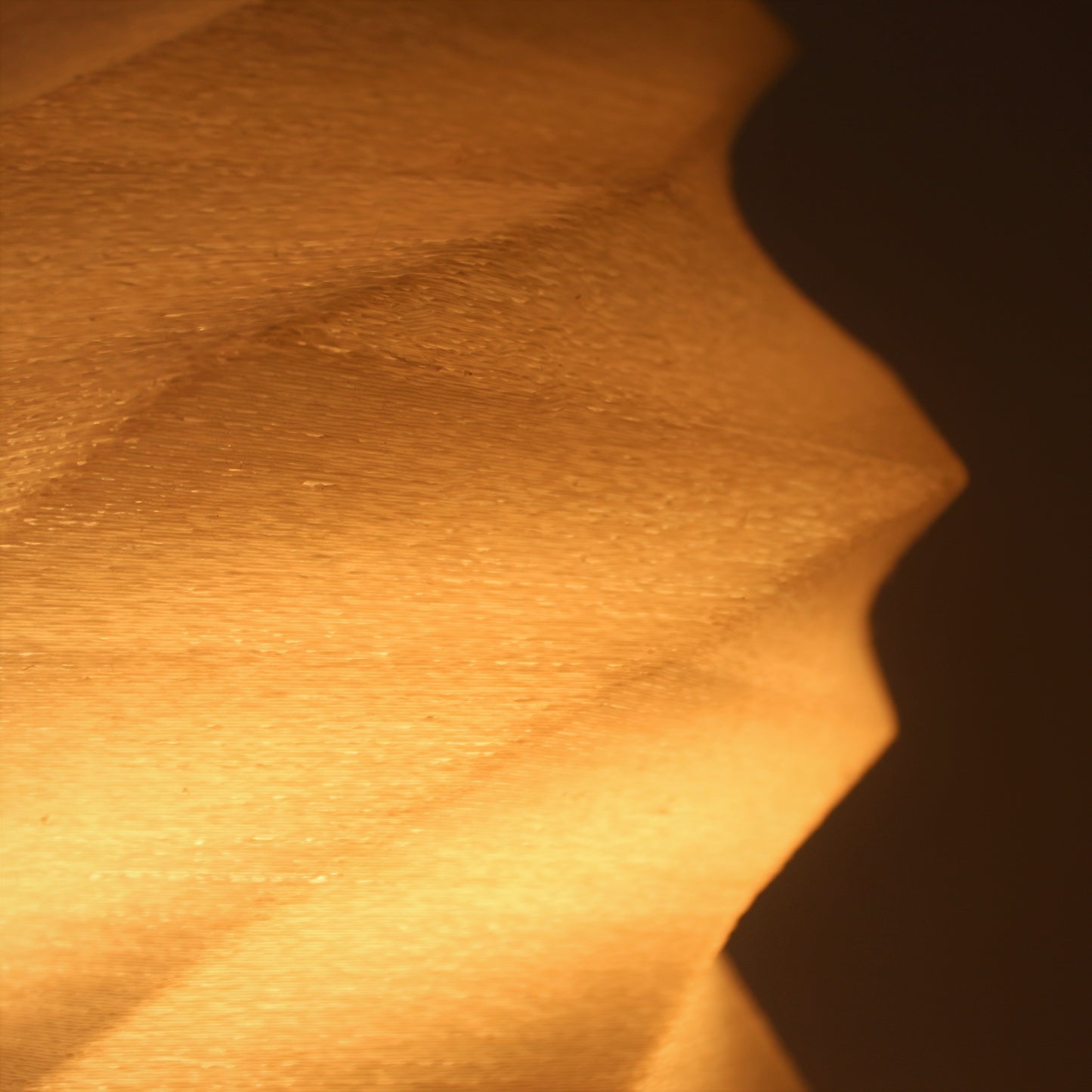 a close up of a light shining on a wall