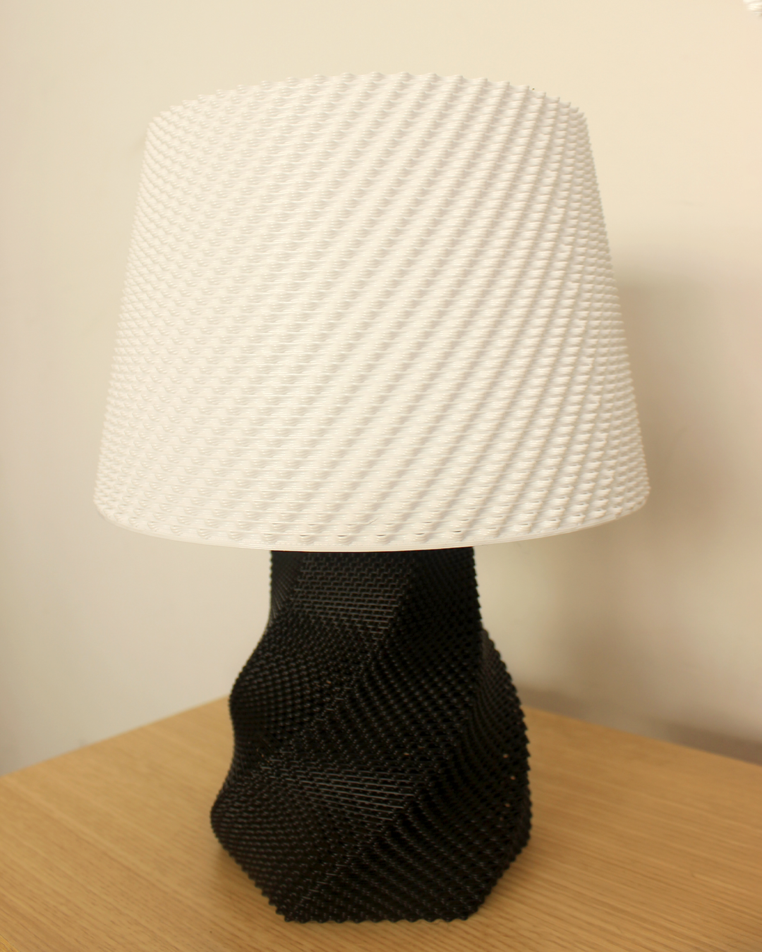 a black and white lamp on a wooden table