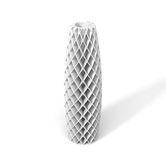 a tall white vase sitting on top of a white floor