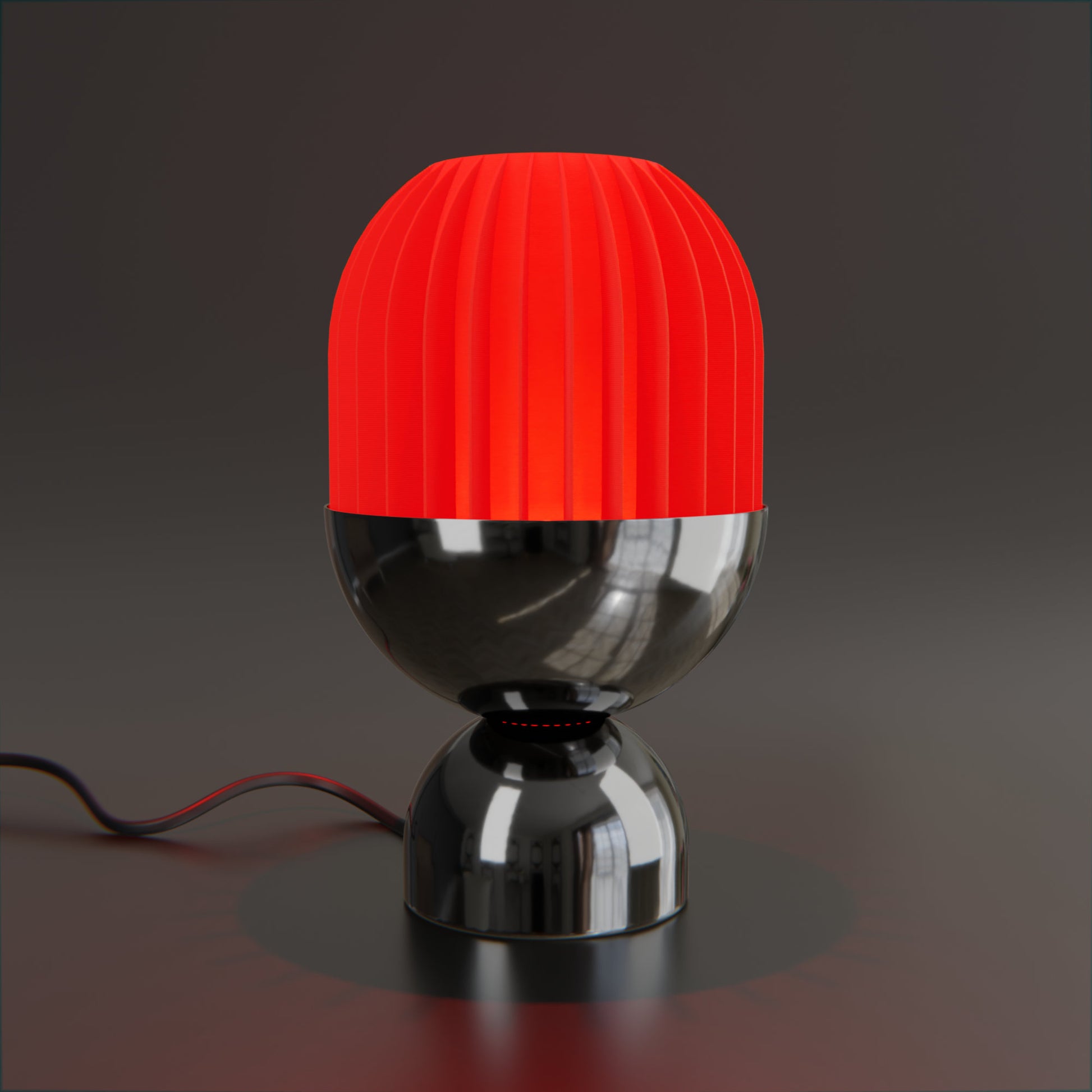 a red and black lamp on a black surface