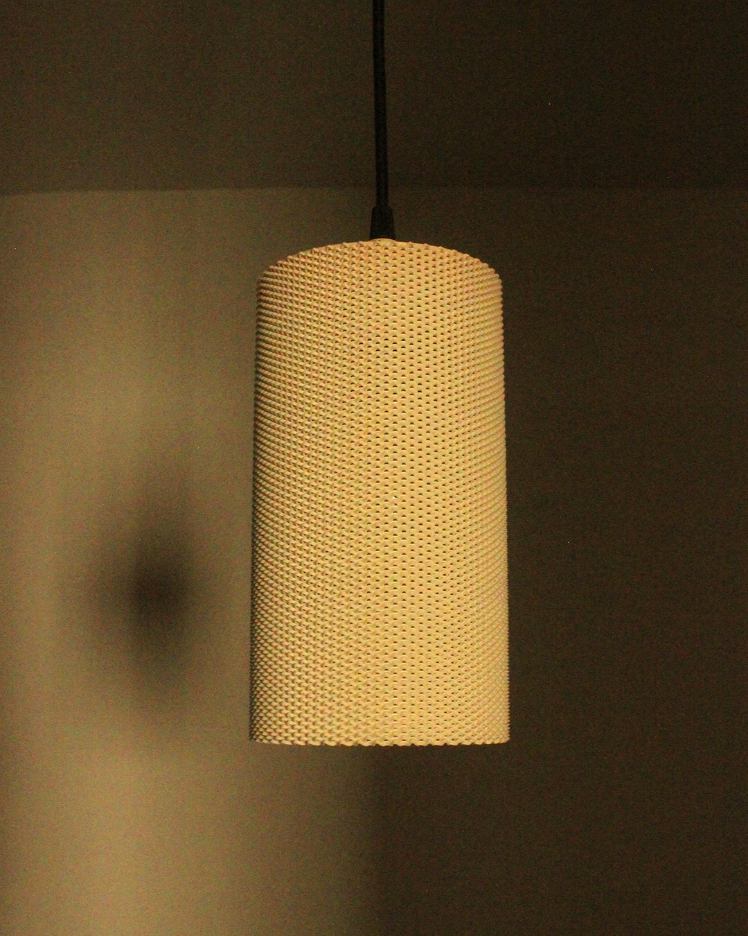 a lamp hanging from a ceiling in a room