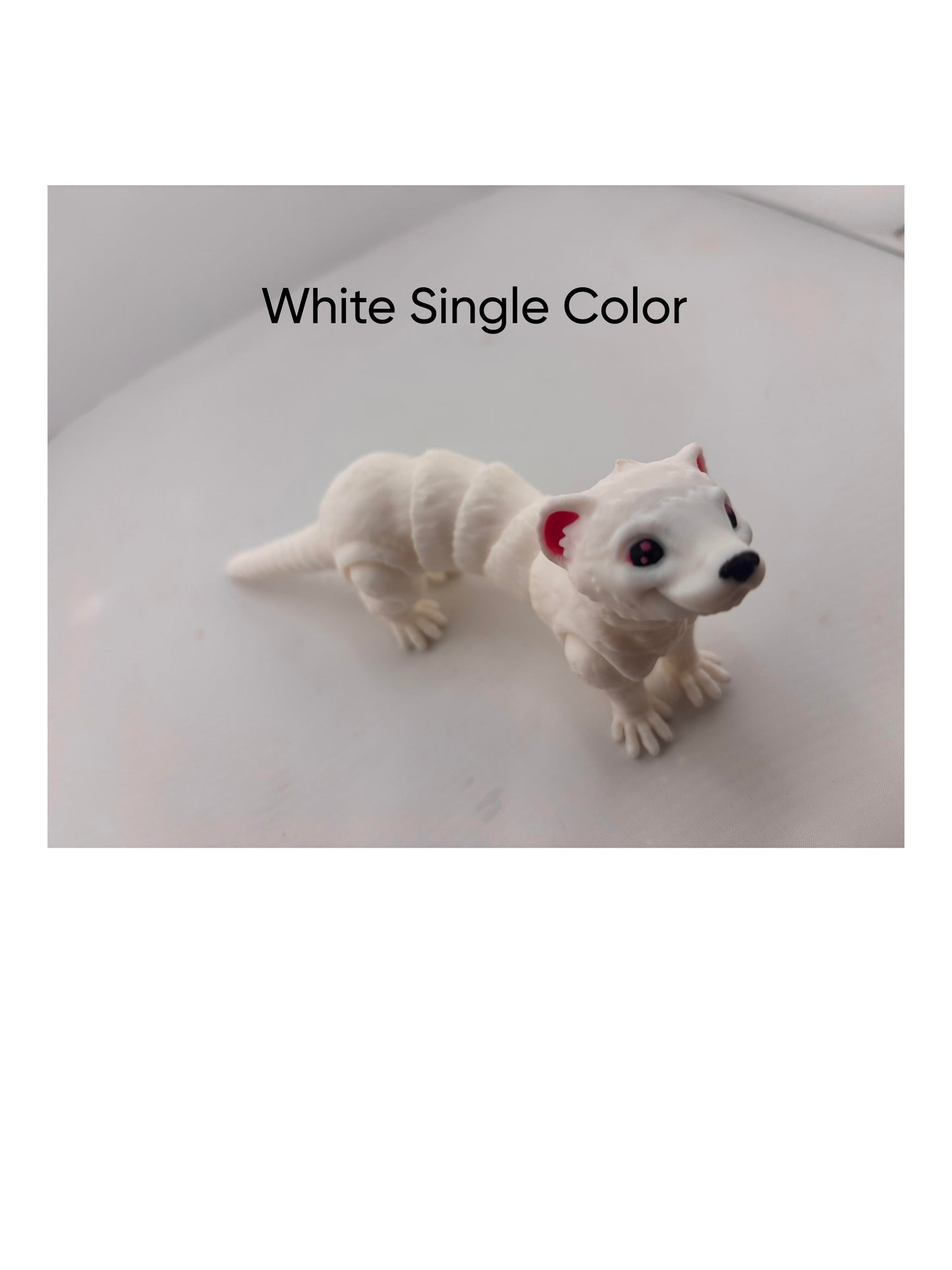 a small white dog with a red nose and tail