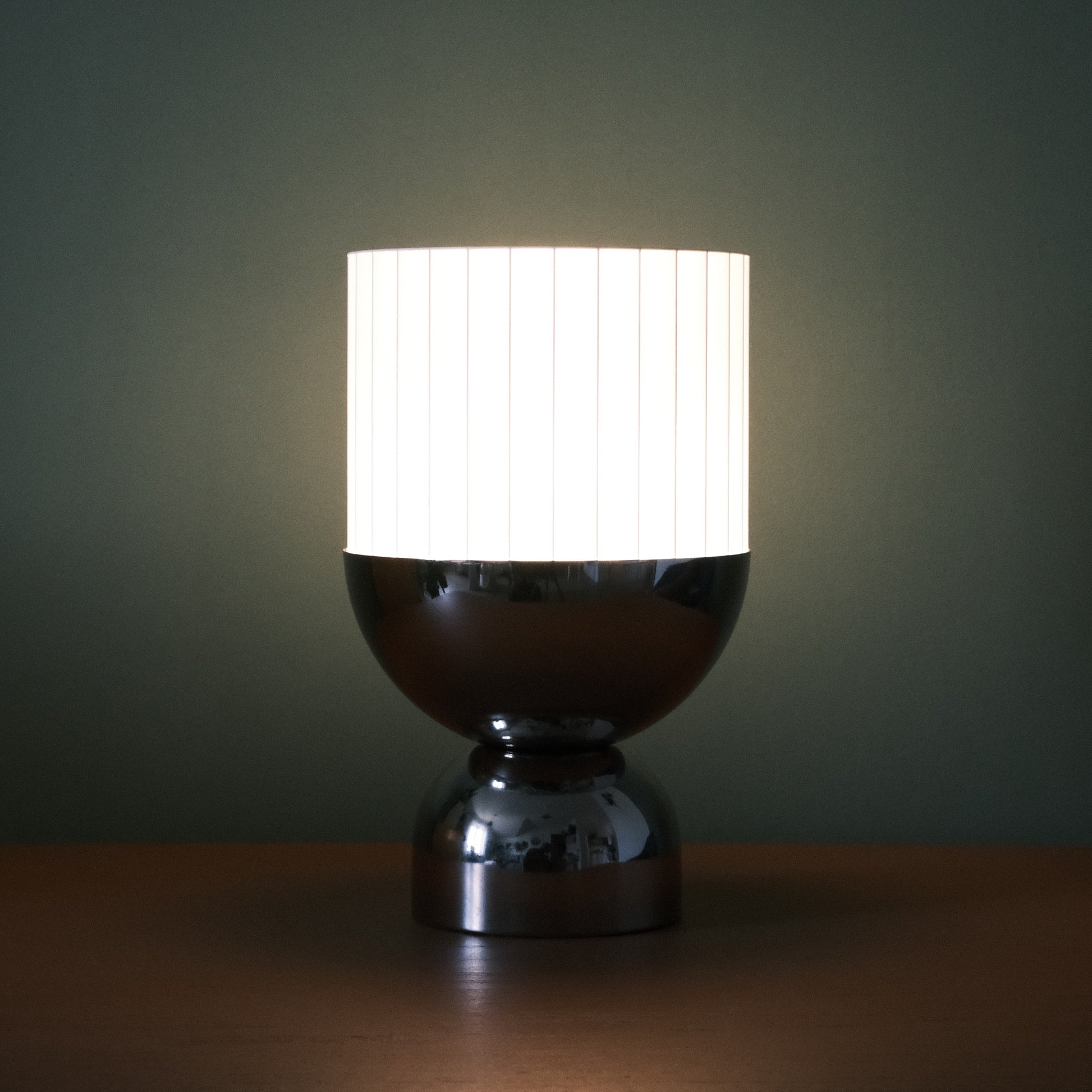 a table with a lamp on top of it