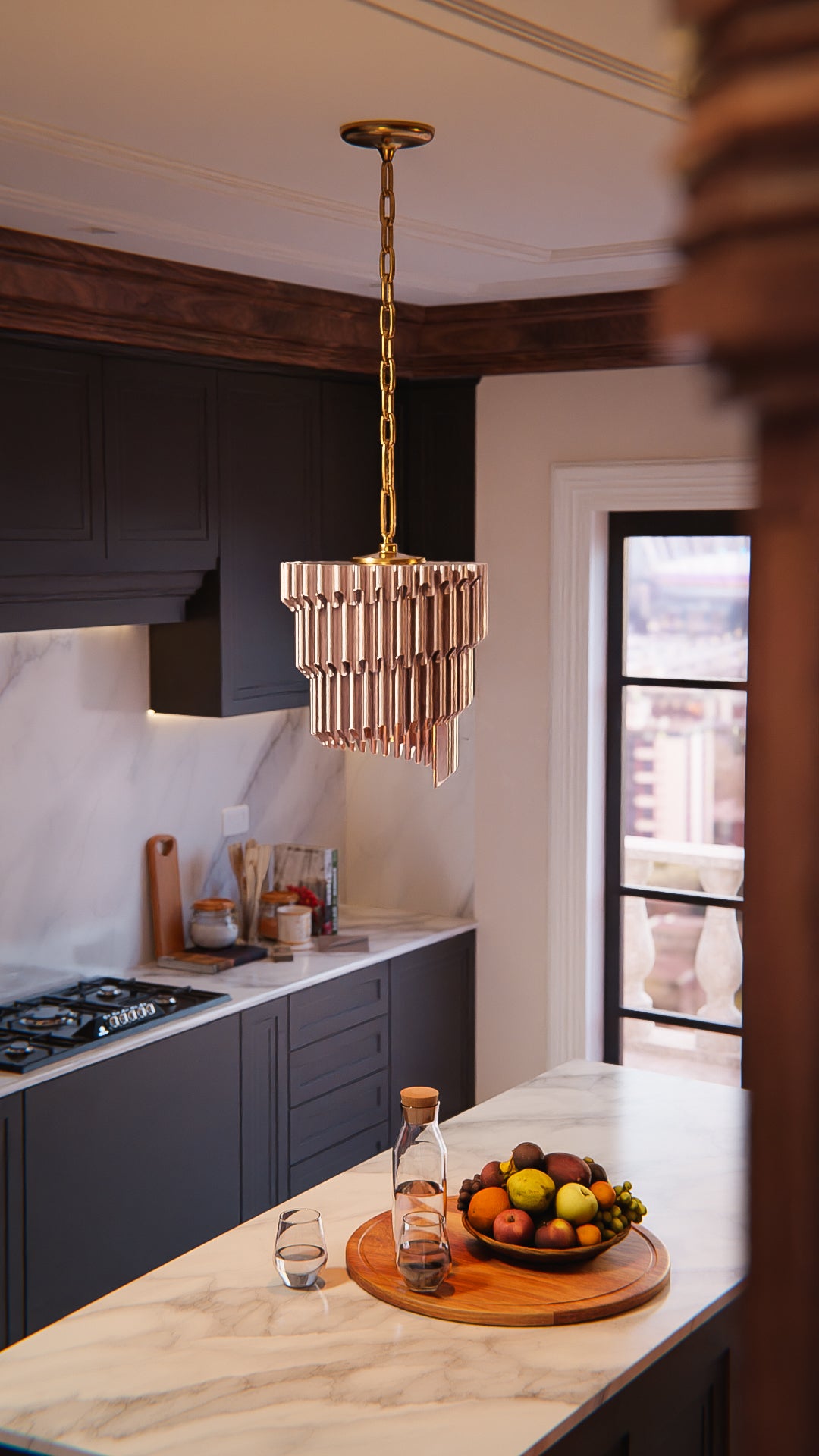 a bowl of fruit sitting on a kitchen counter