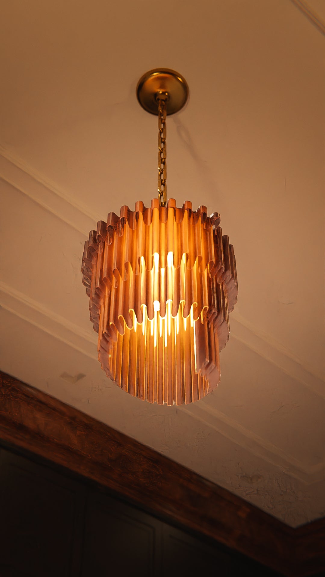 a chandelier hanging from a ceiling in a room