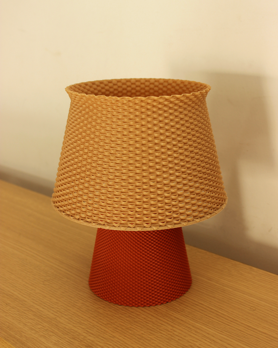 a lamp shade sitting on top of a wooden table