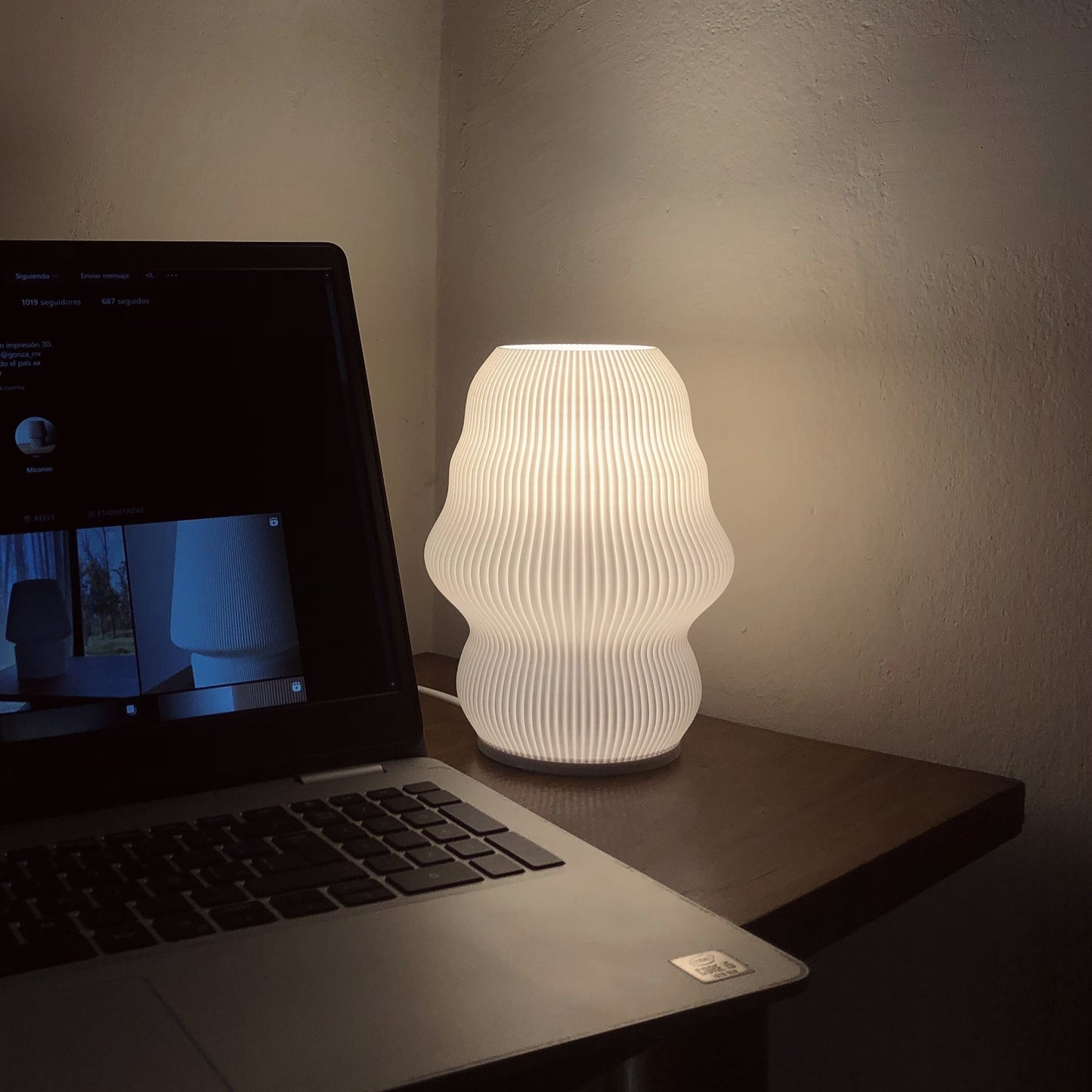 a laptop computer sitting on top of a wooden desk