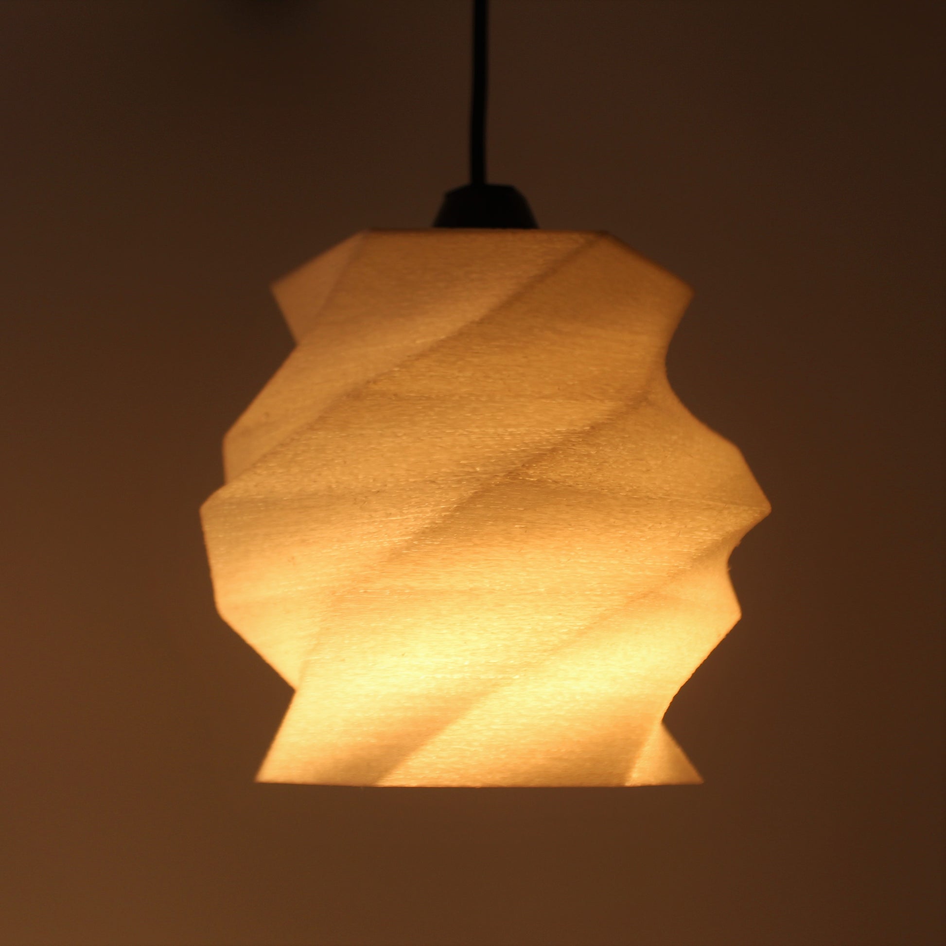 a light hanging from a ceiling in a room