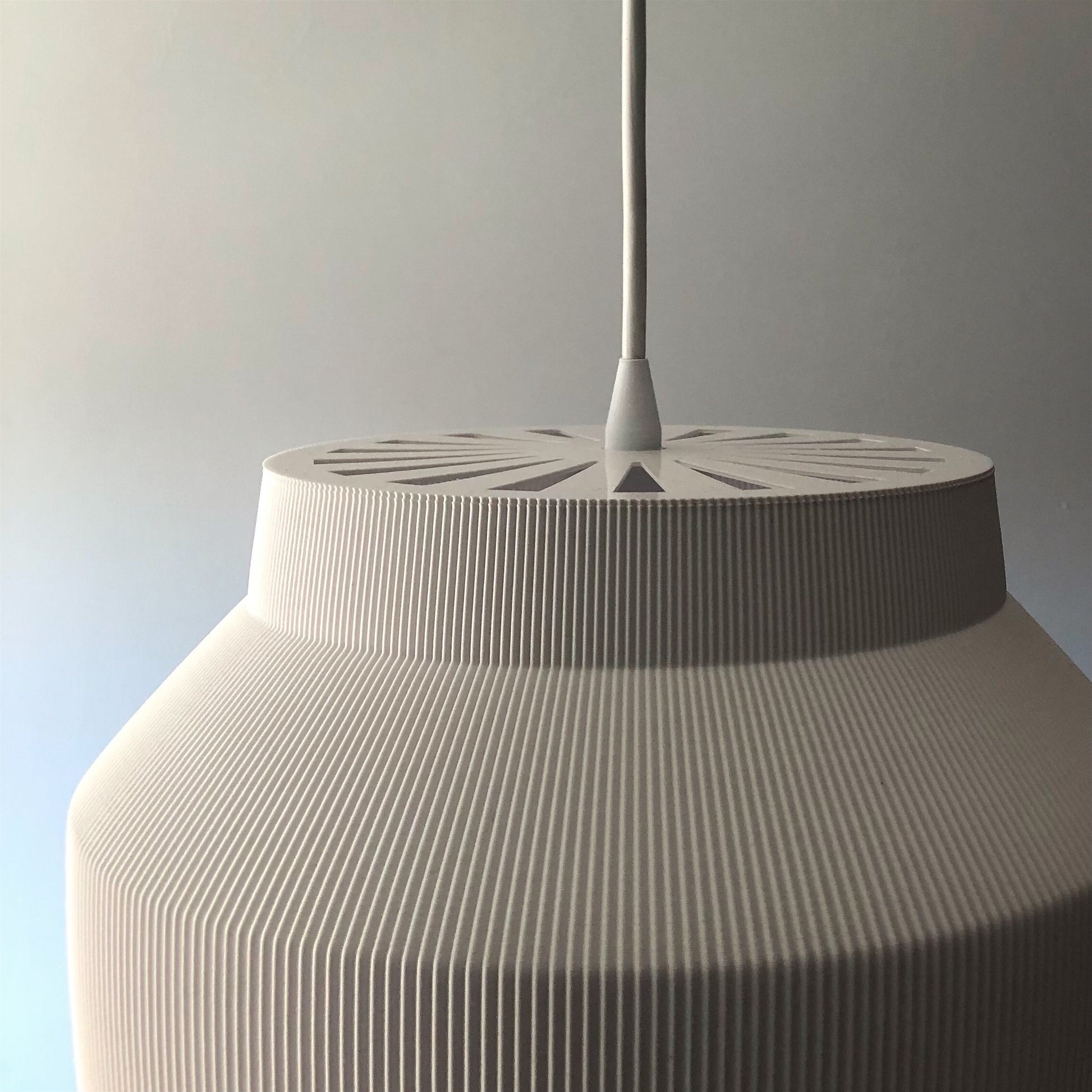 a large white vase sitting on top of a table