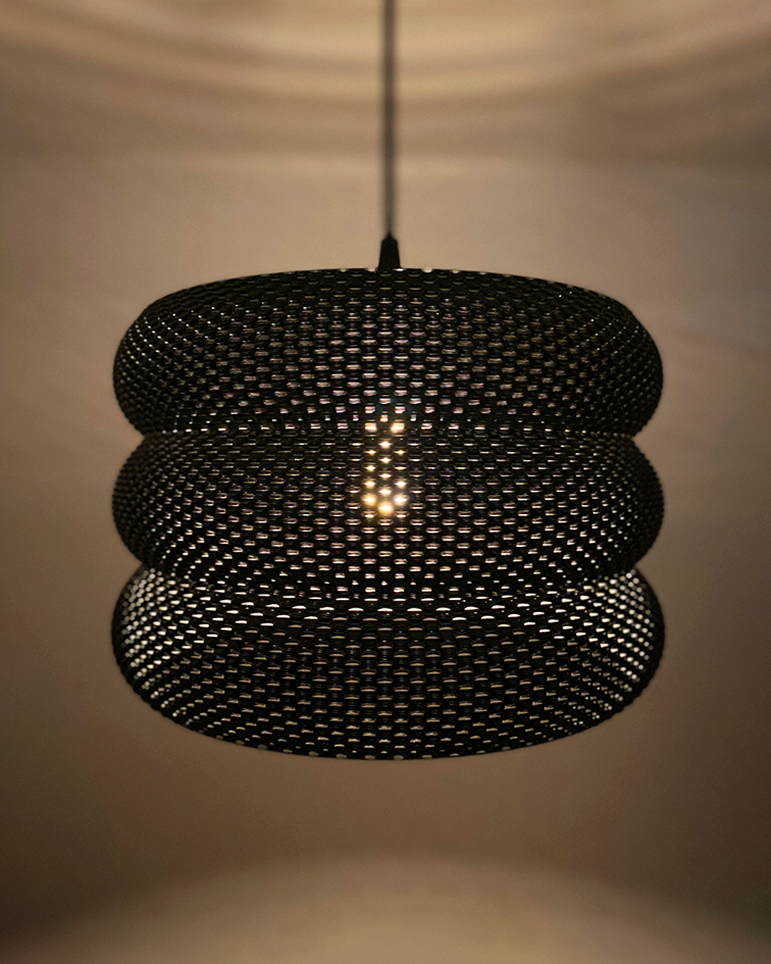 a close up of a light hanging from a ceiling