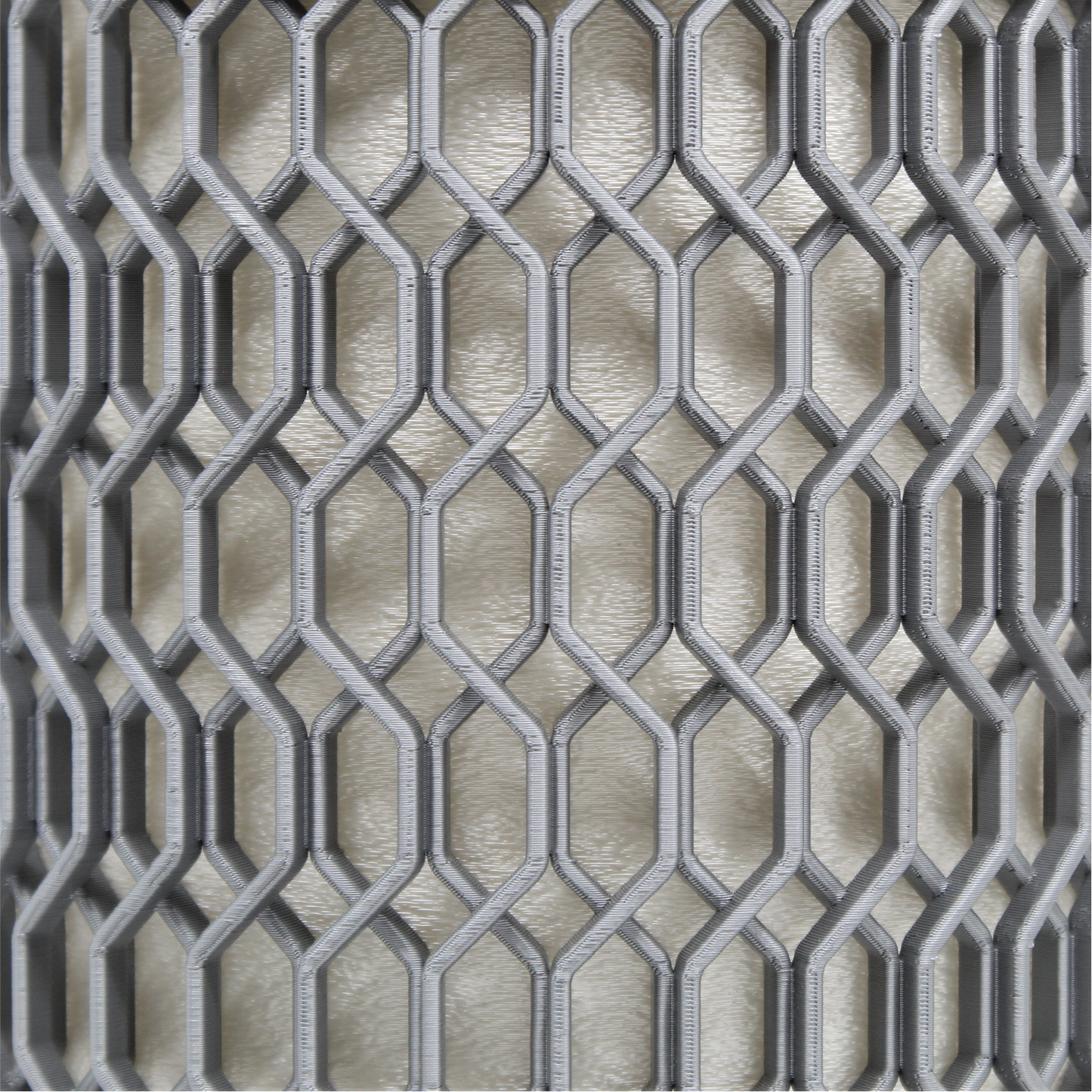 a close up of a metal grate on a wall
