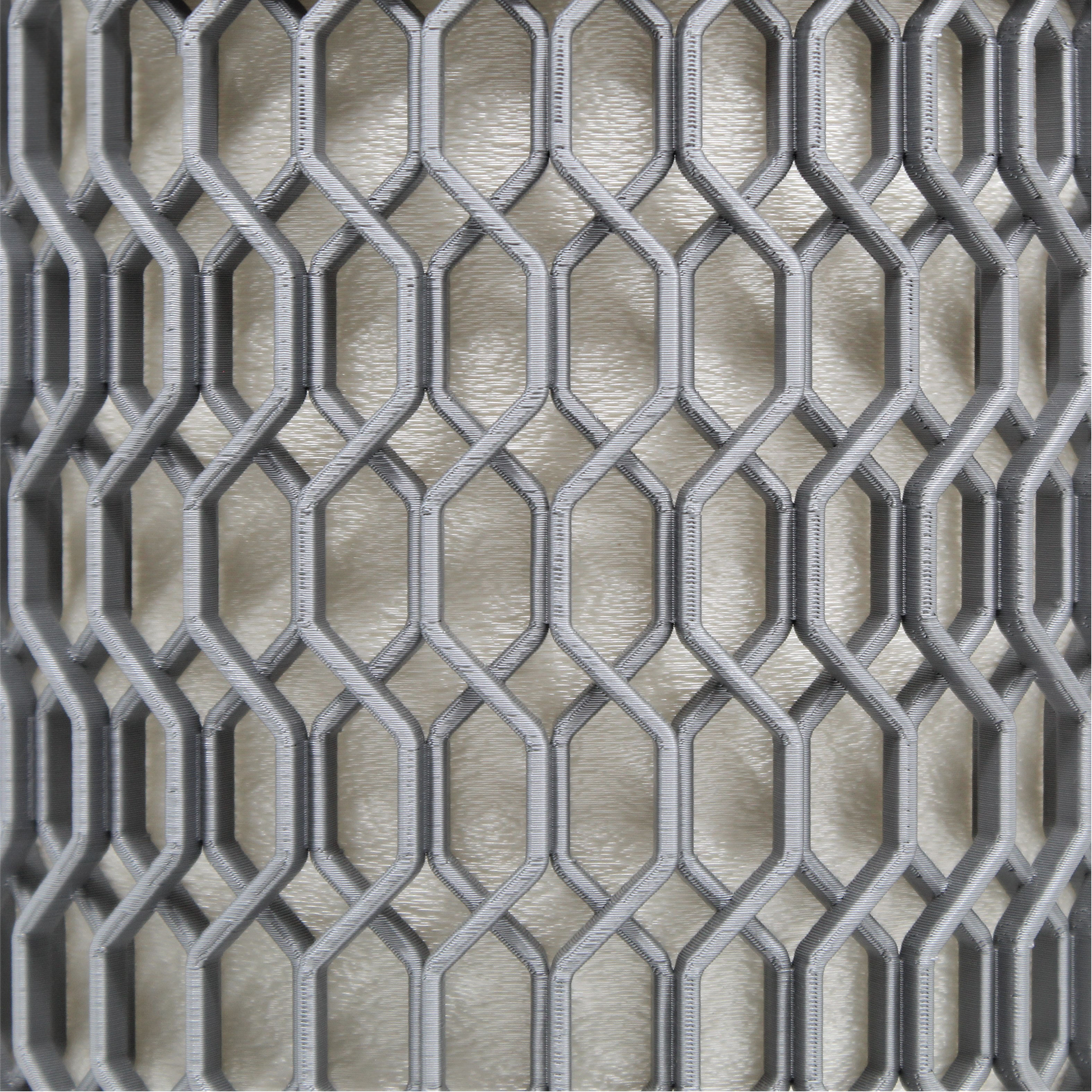 a close up of a metal grate on a wall
