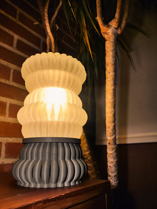 a lamp sitting on top of a wooden table