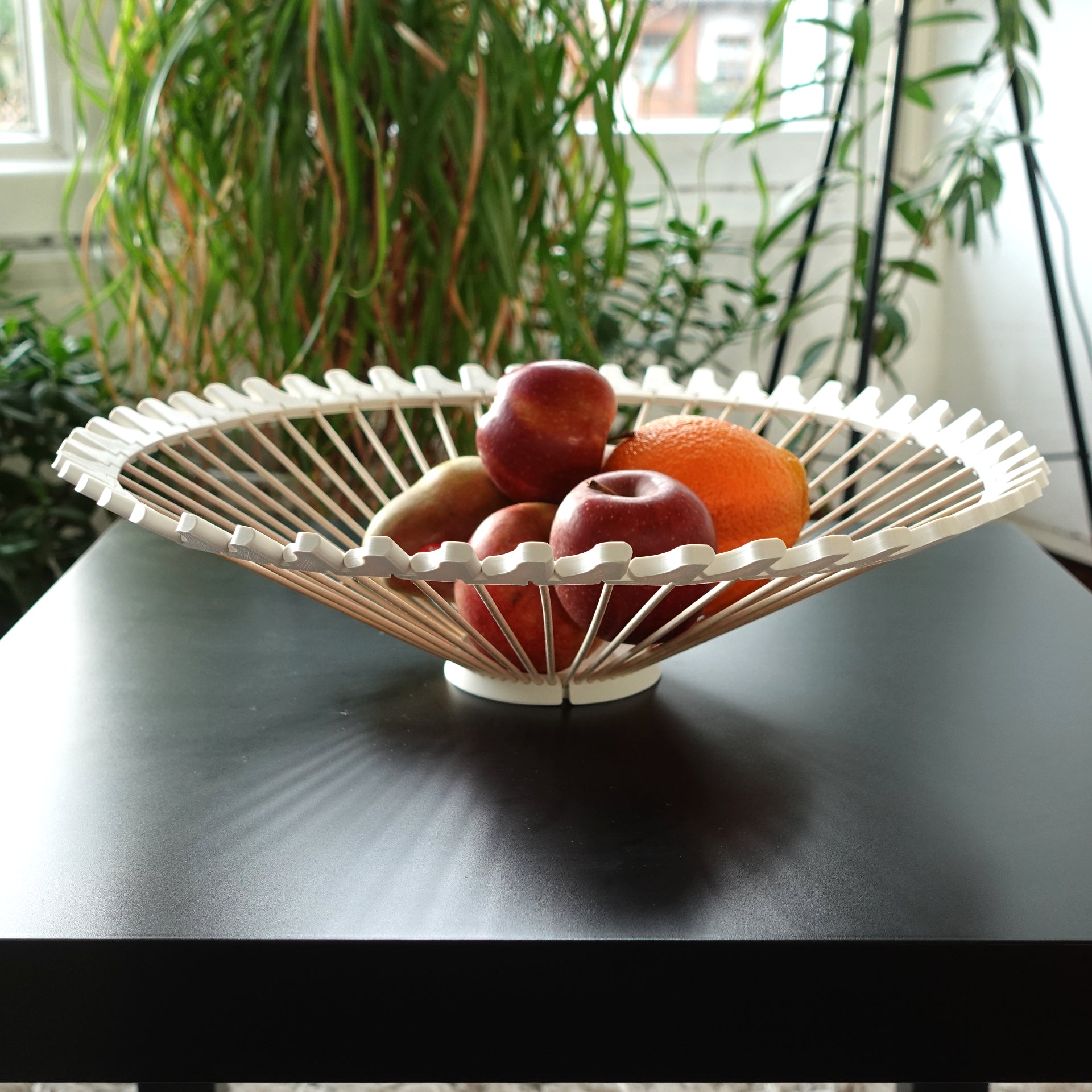 a bowl of fruit is sitting on a table